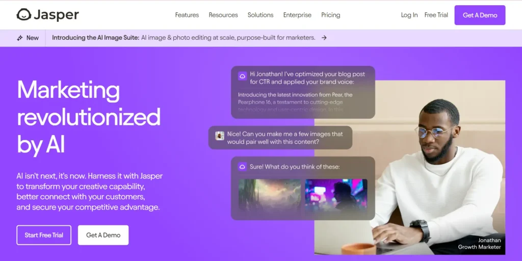 The image displays a webpage from Jasper AI, promoting its AI-powered marketing platform. The headline "Marketing revolutionized by AI" is prominently displayed, emphasizing the platform's ability to transform creative capabilities, improve customer connections, and provide a competitive advantage. There are two prominent call-to-action buttons: "Start Free Trial" and "Get A Demo."

A conversation bubble demonstrates the AI optimizing content and creating images for a user named Jonathan, a Growth Marketer. The design features a clean, modern look with a purple background, and an individual working on a laptop is shown on the right. The page promotes Jasper AI as a solution for leveraging AI to enhance marketing strategies.