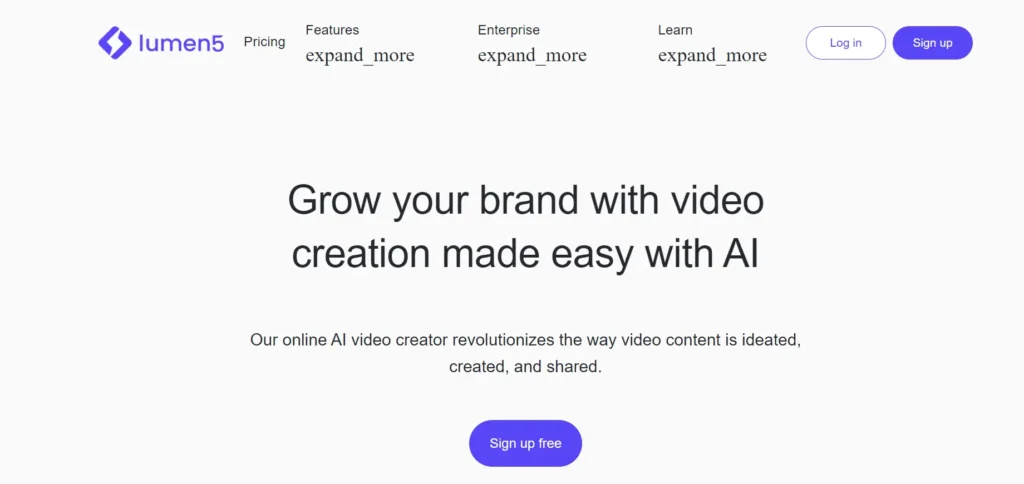 The image is from Lumen5, a platform offering AI-powered video creation. The headline reads, "Grow your brand with video creation made easy with AI," with a subtext that explains how their online AI video creator revolutionizes the way video content is ideated, created, and shared. The page includes a prominent "Sign up free" button and navigation options like "Pricing," "Features," "Enterprise," and "Learn," along with "Log in" and "Sign up" buttons.