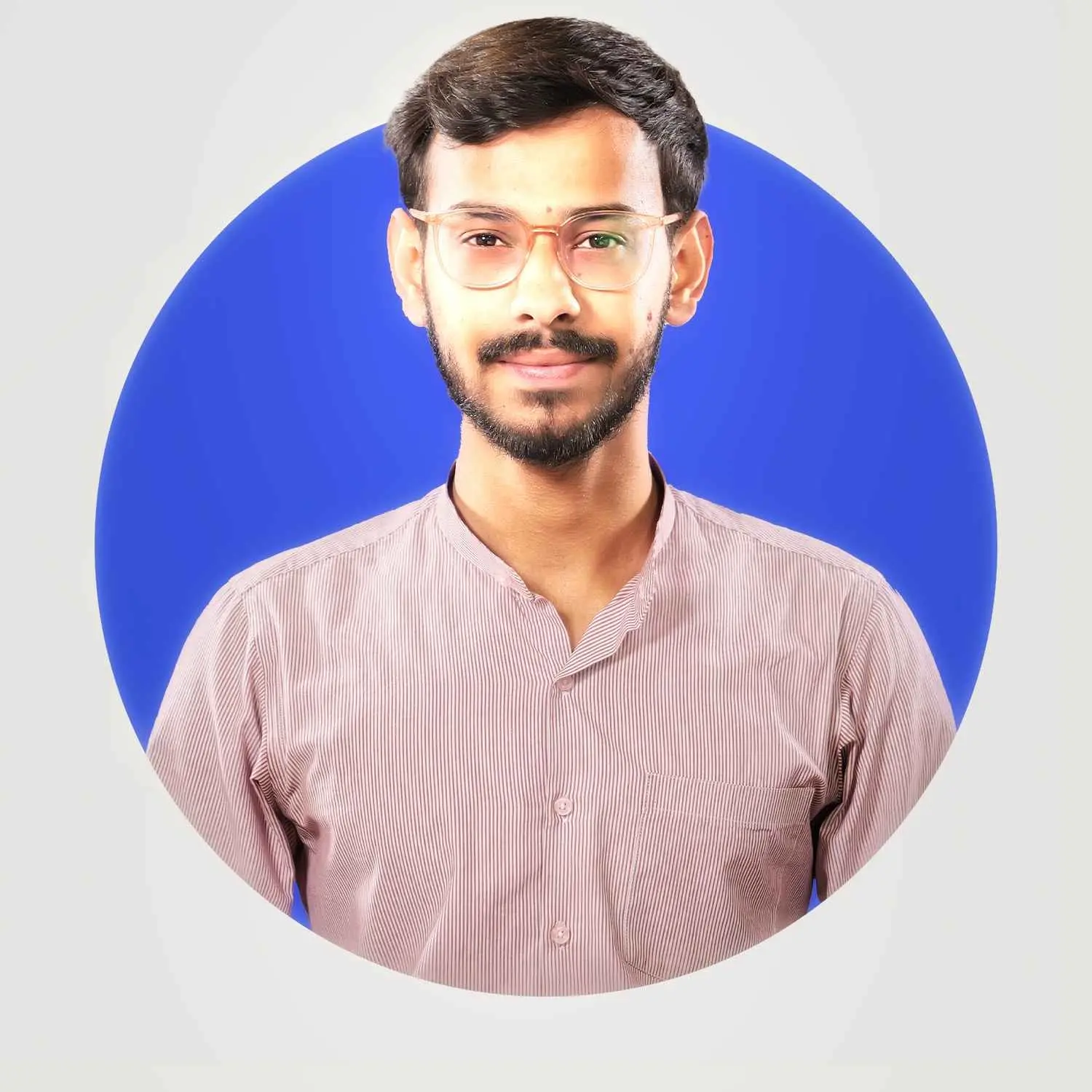 Image of Muhib with short hair and a beard, wearing glasses and a light pink button-up shirt, standing against a blue circular background.