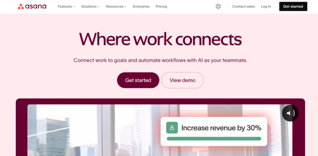 The image is a webpage from Asana, featuring the tagline "Where work connects." It promotes using Asana to connect work to goals and automate workflows with AI as a teammate. The page offers buttons to "Get started" or "View demo." The layout is sleek, with a light pink background and maroon buttons. The page highlights using AI to help achieve work goals, showcasing a sample prompt that says, "Increase revenue by 30%." There are also navigation links at the top, allowing access to features, solutions, resources, enterprise, pricing, and a login button.